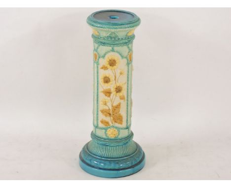 A Burmantofts pottery pedestal, circa 1885, moulded and decorated with a glazed sunflower, impressed monogram, and numbered '