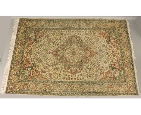 A Turkish rug, with large central medallion and foliate spandrels, on light ground, 202 x 298cm