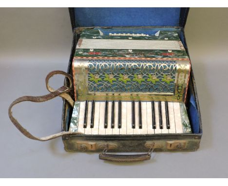An accordion, boxed, by Soberano Steel Reeds