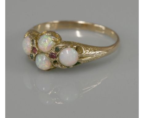 A late Victorian four stone opal ring, with gemstone points, tested as approximately 15ct gold