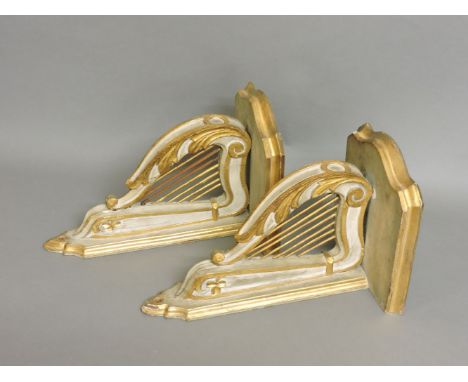 A pair of carved wood wall brackets, on harp supports, 32 x 19cm