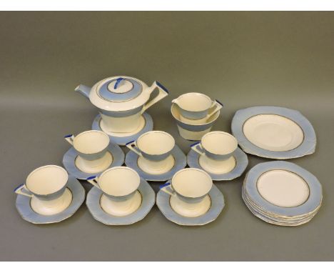 An Alfred Meakin tea service, Marigold pattern, white ground with blue and gilt design, in the Art Deco style