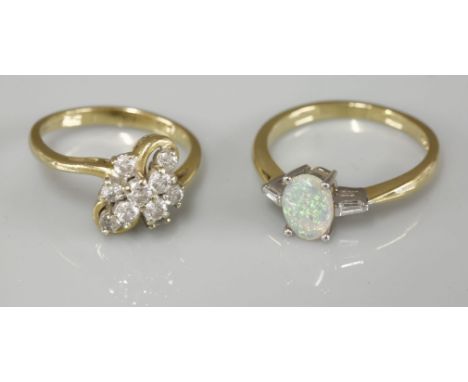 An 18ct gold single stone opal ring, with tapered baguette cut diamond shoulders, and an 18ct gold diamond set spray ring