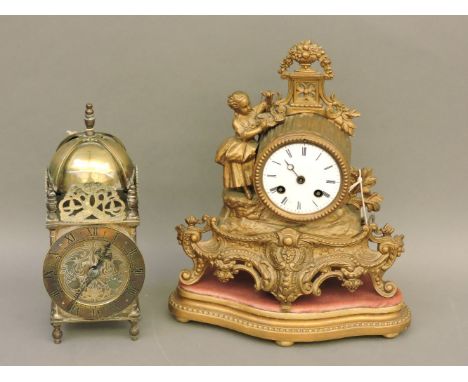 A French rococo style mantel clock, and a French brass lantern clock