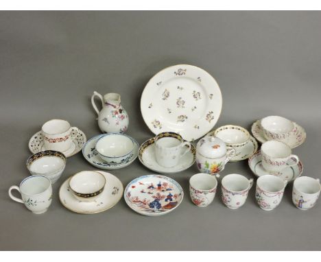 A collection of English 18th century porcelain tea bowls, teacups and saucers, including Worcester, Liverpool, a cream jug, a