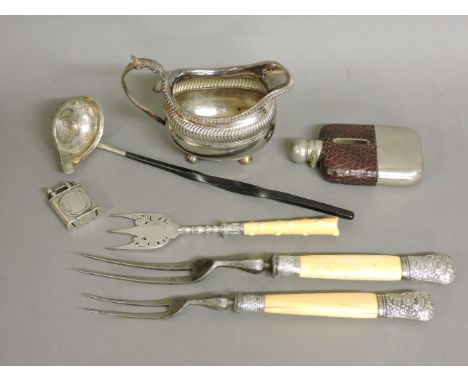 A pair of Victorian silver mounted steel and ivory handled carving forks, a toasting fork, a Victorian silver milk jug, a sil