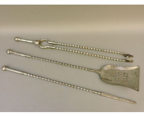 A set of three 19th century iron fire tools, with twist turned stems