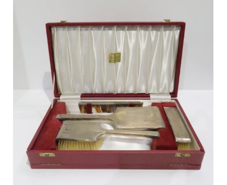 A cased silver four piece vanity set, in the art deco style, with engine turned geometric decoration, by&nbsp;Deakin &amp; Fr