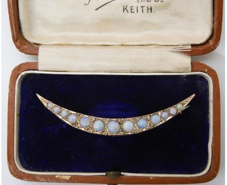 A 9ct gold opal set crescent moon brooch, hallmarked Chester 1908, length 5.2cm, weight 2.7gms Condition Report:Available upo