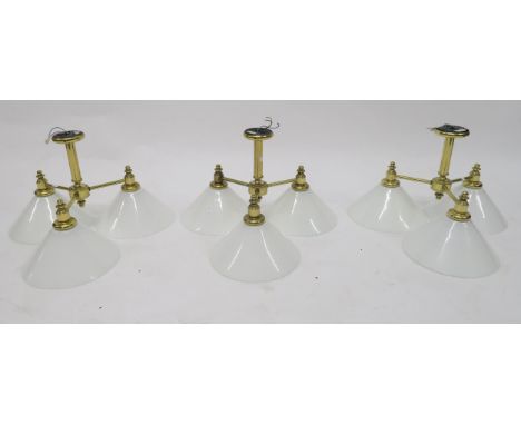 A lot of three contemporary brass three branch ceiling light fixtures with milky glass shades (3) Condition Report:Available 