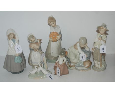 A group of Nao figures including a girl holding a pumpkin, a girl with a spilt pail of milk etc Condition Report:boy in hat c