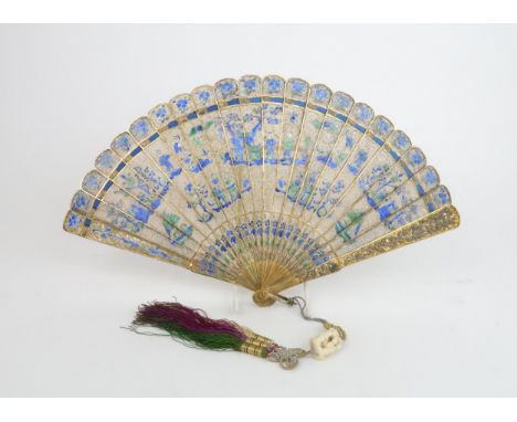 A CHINESE EXPORT GILT METAL FILIGREE BRISE FAN the sticks painted in shades of blue and green enamels with figures amongst pa