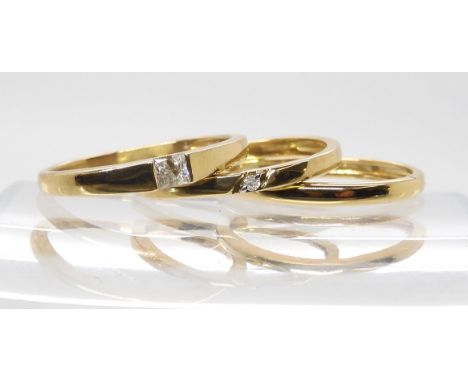 A 9ct princess cut diamond ring of estimated approx 0.10cts, size K, and two band rings one set with a small diamond both siz