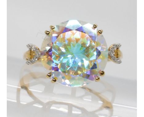 A 9ct gold pastel rainbow mystic topaz with diamond crescent moon shoulders, size K, weight 3.7gms Condition Report:Available