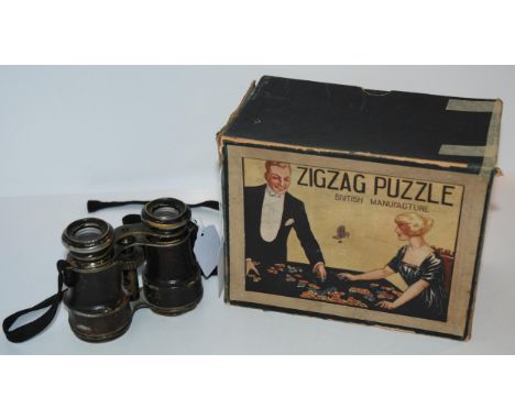 A vintage Zigzag Puzzle in original box and a pair of vintage field glasses (2) Condition Report:Available upon request