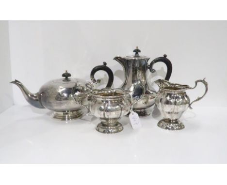 A four piece EPNS tea service, comprising tea pot, coffee pot, milk jug and twin handled sugar bowl, of lobed form with scrol