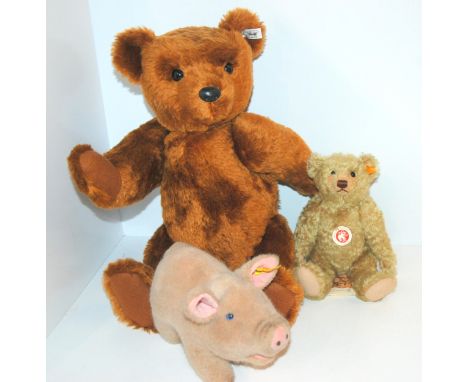 A large modern Steiff Teddy bear, smaller Steiff Teddy bear and Steiff piglet, 50cm high and smaller (3) Condition Report:Ava