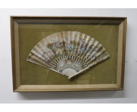 A FRAMED 18TH CENTURY CHINOISERIE FAN the leaf painted with figures working in a landscape, with a rectangular monochrome vig