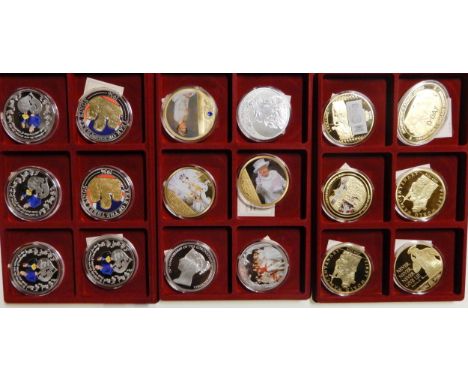 A lot of gold plated and silver plated commemorative coins to include Gold of the Vatican, RMS Titanic, The Guinea 1663, The 