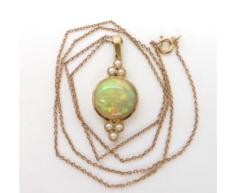 A 15ct gold opal and pearl pendant, with a 9ct 47cm long trace chain, opal diameter approx 12mm. Condition Report:this is a s