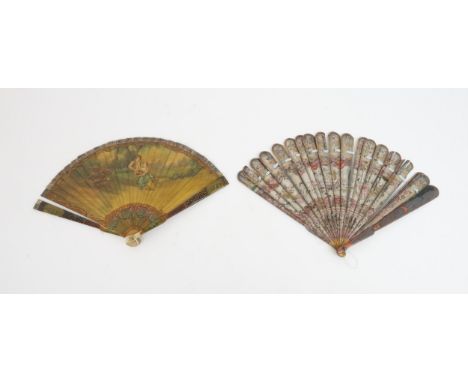 A FRENCH IVORY VARNISHED BRISE FAN the ivory sticks varnished in the 'Vernis Martin' style, painted with a courting couple in