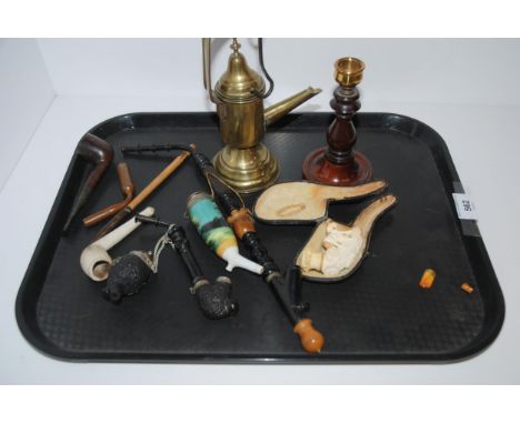 A tray lot including various smoking pipes, brass taper and candle stick Condition Report:Available upon request