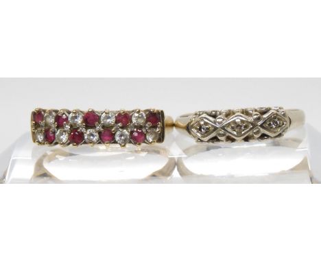 A 14k gold three stone diamond ring, size N1/2, together with a 9ct gold ruby and cz ring, size N1/2, weight 2.1gms Condition