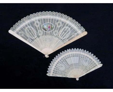 A CHINESE EXPORT IVORY BRISE FAN The sticks carved with lattice work and diaper pattern roundels surrounding a central painte