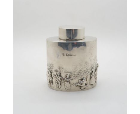 A silver tea caddy, of oval form with repousse decoration depicting a pastoral scene, by&nbsp;George Nathan &amp; Ridley Haye