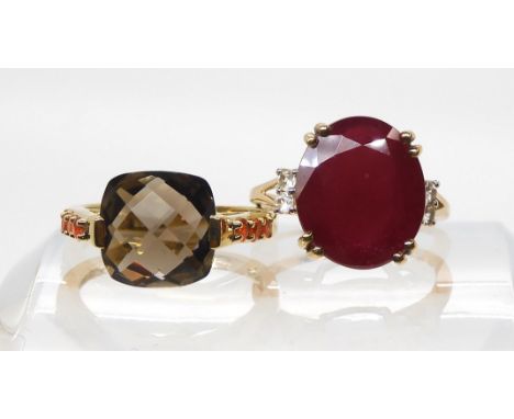 A 9ct gold ruby ring, size K, weight 3.7gms, together with a 9ct smoky quartz and fire opal ring size K1/2, weight 6.5gms Con