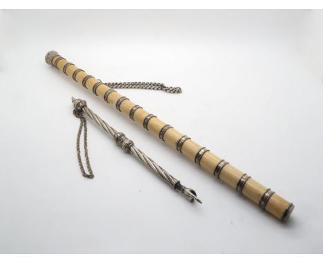 A silver coloured torah pointer, with twisted stem and case foliate tip, the pointer stamped 925, 24cm, a Victorian white met