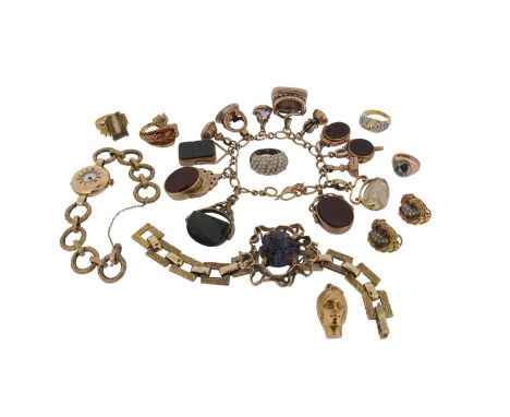 A gold charm bracelet, mounted with assorted fob seals and swivel seals. A textured gold bracelet mounted with an amethyst cr