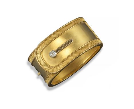 A late-Victorian gold cuff-form hinged bangle. Realistically designed and with a cushion-shaped diamond forming a button. 5.8
