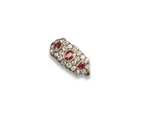 A late Victorian triple ruby and diamond cluster ring, the three oval-shaped rubies are set in surrounds of old circular-cut 