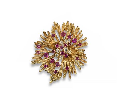 A French ruby and gold floral brooch. Centred with cabochon rubies and set in yellow gold. French control marks. 5cm high.