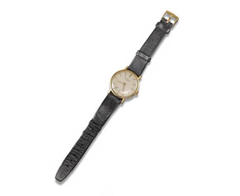 A gentleman's gold wristwatch by Patek Philippe, the cream enamel dial with gold baton numerals. Manual winding. Associated b