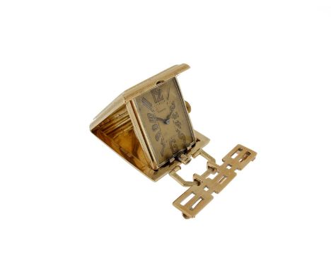 A gold folding travel clock by Eszeha, the rectangular gold engine turned case with spring-loaded clasp which reveals the clo