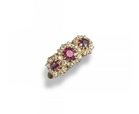 An Edwardian ruby and diamond triple cluster ring, the three circular-cut rubies are set within surround of old circular-cut 