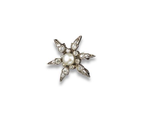 An Edwardian pearl and diamond star-shaped brooch. Centred with a button-shaped pearl within a surround of small diamonds, an