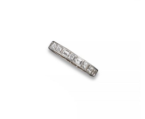 A diamond full circle eternity ring, the baguette-shaped diamonds are set in platinum. Size K 1/2.
