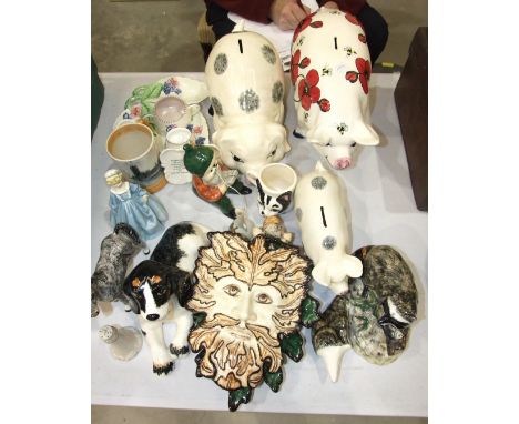 A collection of Babbacombe pottery, including three pig money banks, a Royal Worcester figure 'Grandmother's Dress', a Poole 