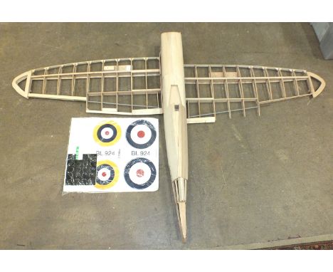 A De Agostini partly-made Spitfire model, with radio control, engine, magazines, templates and decals. 