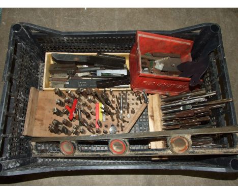 A collection of lathe tools and milling machine bits. 
