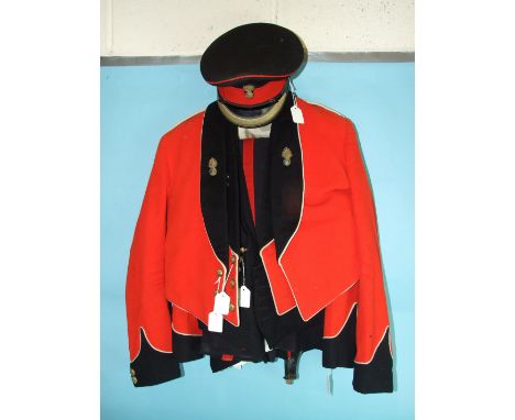 Two Royal Welch Fusiliers dress uniforms, comprising: jacket, waistcoat and trousers and a No.2 service jacket and cap. 