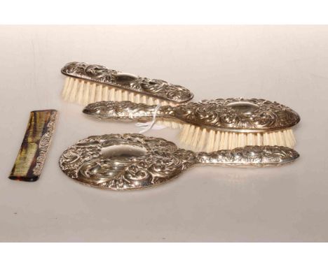 Silver three-piece dressing table set and a silver mounted comb (4)