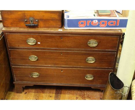 Georgian mahogany chest of three long drawers on bracket feet