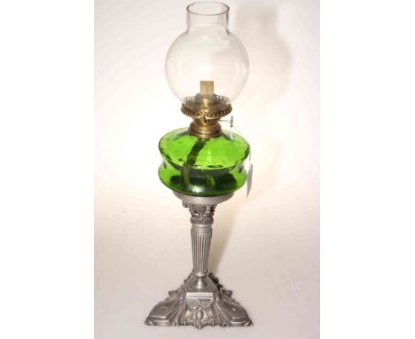 Early 20th Century oil lamp with green glass reservoir, 44cm high