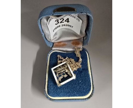 9CT GOLD ENAMEL BUCKLE WITH MONOGRAM SEAD PEARL MOUNT ON 9CT GOLD CHAIN, WEIGHT APPROX 2.2 GRAMS