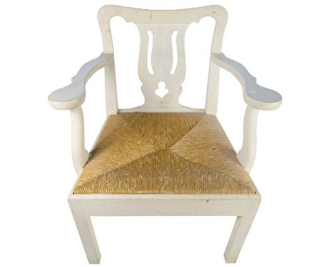 A set of four armchairs designed by Peter Hone In oak painted off-white, the chairs are inspired by the designs of Chippendal