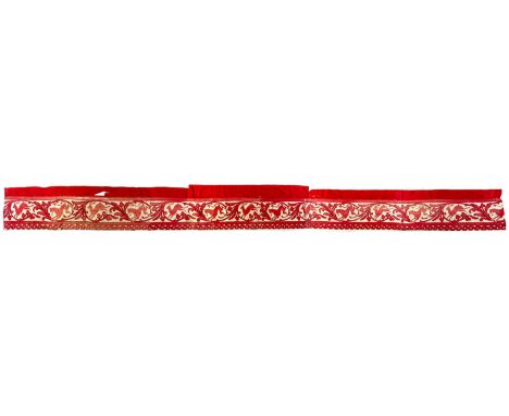Appliqued valance of red & white silk laid upon red cotton A long bed valance of leaping deer being chased by a rampant lion 